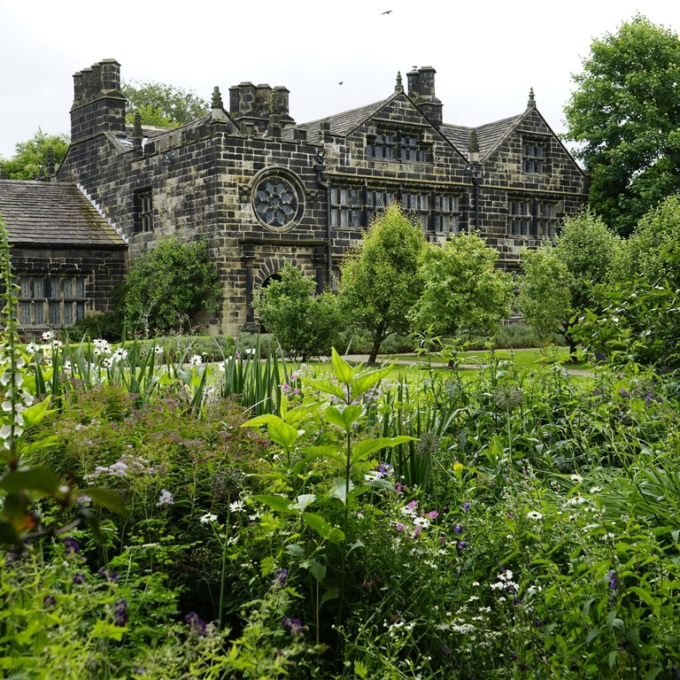 An English manor house and formal gardens