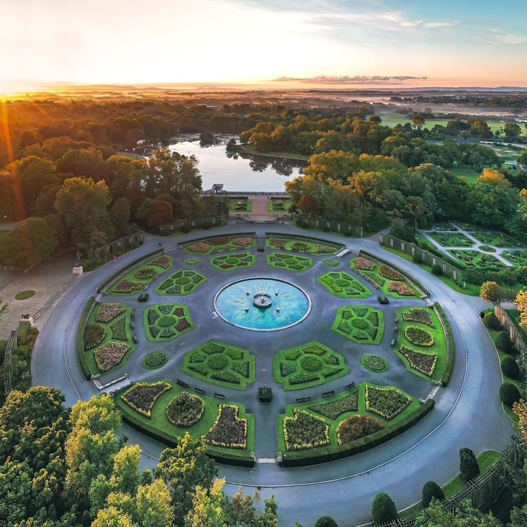 Aerial shot of a park and gardens at sunset.