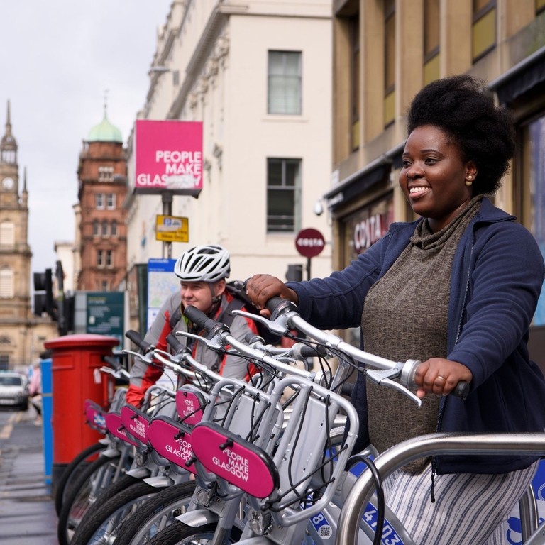 Cyclist using bike hiring scheme in Glasgow