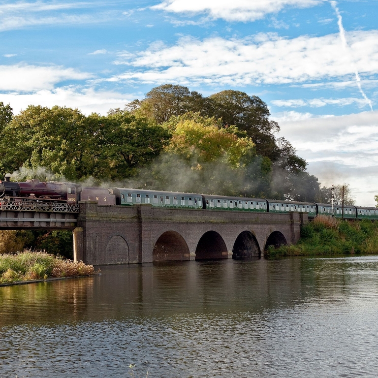 A train crosses a bridge as part of the Great Central Railway