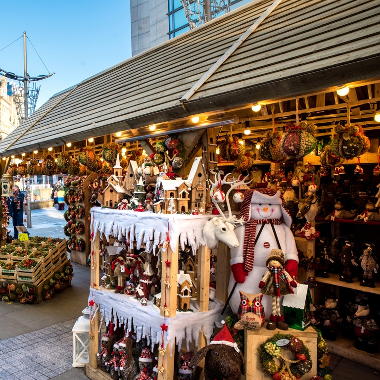 Christmas market stalls lining Cathedral Street in Manchester