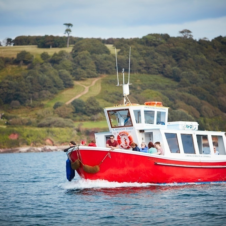 A group of people on a boat trip near the coast of Plymouth