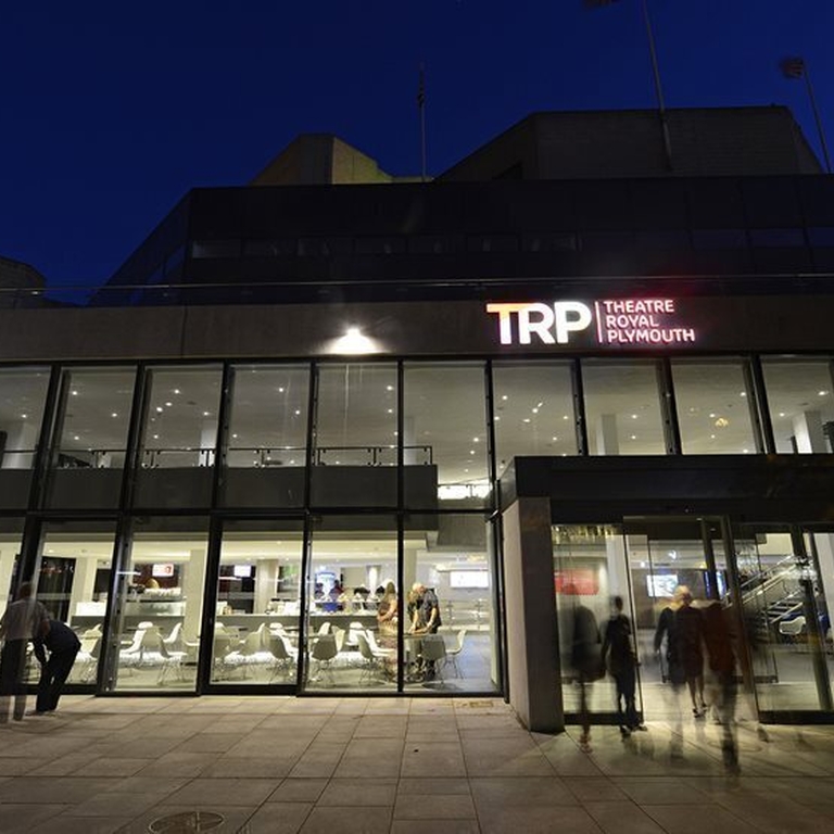 An outdoor nighttime view of the Theatre Royal Plymouth