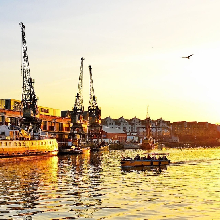 A yellow and blue Bristol Ferry on Bristol's waterways