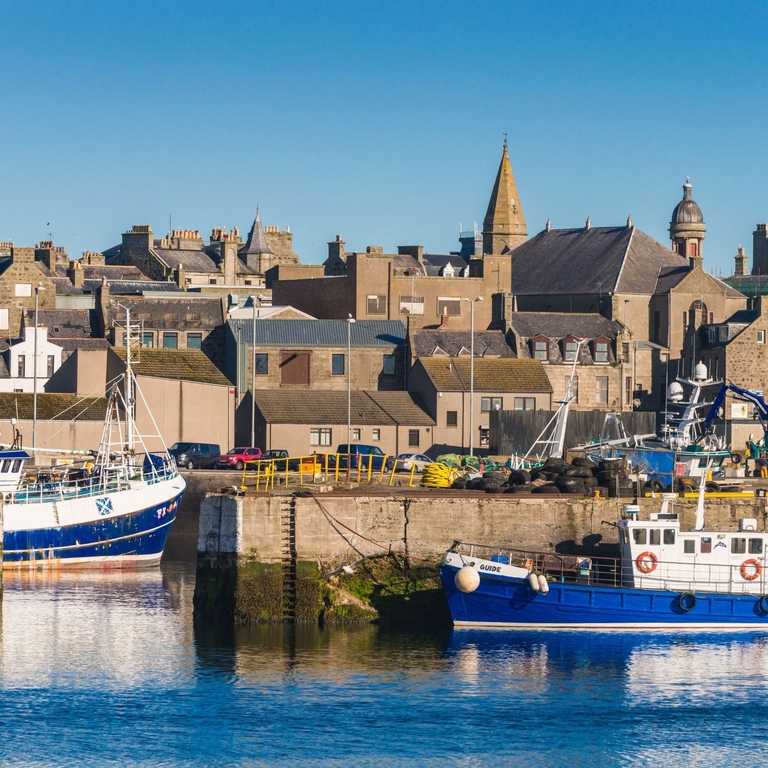 Boats in a harbour in a British seaside town. 