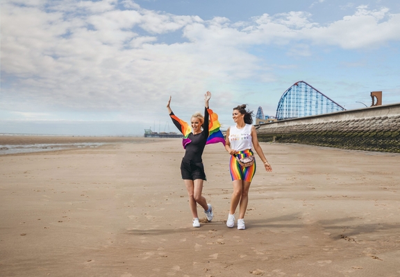 Two women having fun on Blackpool beach