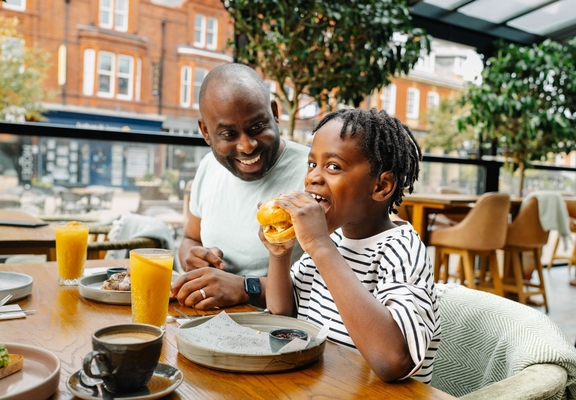 Father and son enjoying brunch at a restaurant