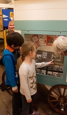 Children looking at an exhibit in the Time & Tide Museum, Norwich