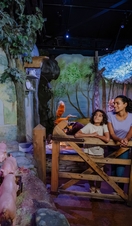 Mother and son looking around at a rabbit themed exhibition.
