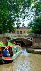A barge sailing down a canal in Bath