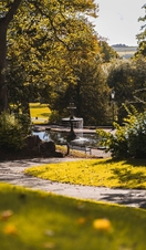 A fountain surrounded by trees in Lincoln Arboretum