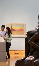 People viewing artwork in the National Museum Cardiff