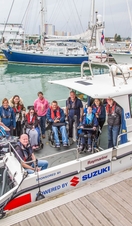 Passengers on a boat at a marina
