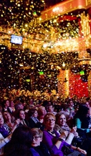 An audience watching a performance in Manchester's Palace Theatre