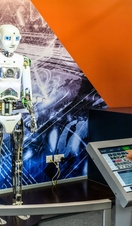 A child playing with an interactive exhibit at a science museum. 