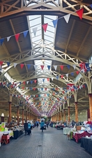 An indoor view of stalls being setup at Barnstaple Pannier Market