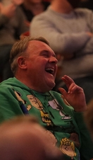 An audience member laughing during a show at Leicester's Comedy Festival