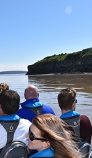 A group of people on a boat tour around Cardiff's bay area