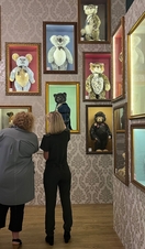 Two women looking at stuffed bears exhibits in Charlie Bears Gallery and Shop, Cornwall
