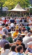 Crowds of people eating and drinking outside as part of Sheffield Food Festival