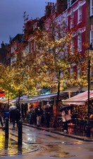 A nighttime shot of St Christopher's Place on Oxford Street, complete with market stalls