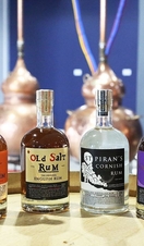 Bottles of Cornish Rum lined up on a table