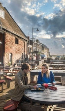 Two people sitting at a table on the Kings Lynn Heritage Trail