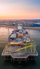 A seaside pier and funfair.