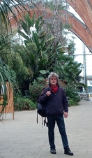 A man posing at an indoor garden as part of the Sheffield City Walking Tours