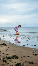 Child on the beach playing