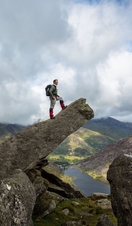 Male hiker admiring view from a pinnacle rock formation