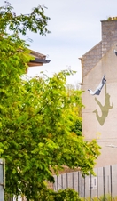 A street art mural on the side of a house. 