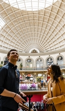 People looking around the interior of Leeds Corn Exchange