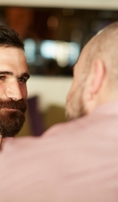 Closeup of two gay men being affectionate