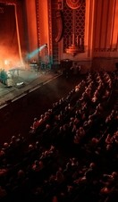 A band performing on stage at the Forum in Bath