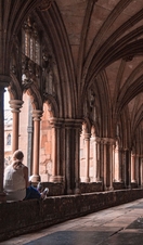 People exploring an outside area of Norwich Cathedral