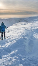 Ski mountaineers enjoy the winter conditions in the hills around Glenshee, Highlands Scotland.