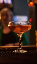 Close up of selection of cocktails on bar counter.