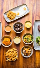 Two people eating steaks at Liverpool's Cowshed Restaurant
