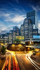 Tall buildings with bright lights in long exposure