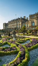 The Victorian formal gardens with statues and low hedges in front of Harewood House