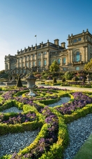 The Victorian formal gardens with statues and low hedges in front of Harewood House
