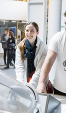 A man and a woman playing with an exhibit at Techniquest in Cardiff