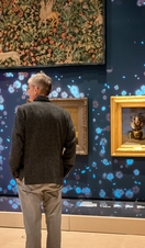 A person looking at artworks in a gallery in Glasgow