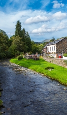 An idyllic river running through a small village in Snowdonia/Eryri National Park, Wales