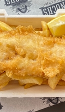 Fish and chips being served at Enochs Fish & Chips in Snowdonia/Eryri National Park