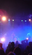 A band performing on stage at Exeter Phoenix