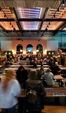 People eating food and drinking in Chester Market