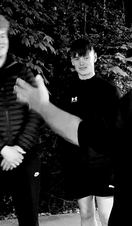 A group of people on a guided ghost walk around the town of Tenby in Wales