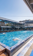 People swimming in an outdoor pool at Bristol Lido